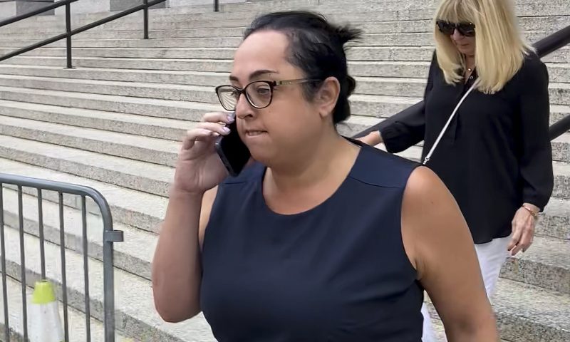 Peaches Stergo, left, leaves Manhattan federal court, Thursday, July 27, 2023, in New York after she was sentenced to more than four years in prison for cheating an 87-year-old Holocaust survivor of $2.8 million. Stergo met him on a dating website seven years ago. Prosecutors say the 36-year-old Champions Gate, Florida, resident used the money to live lavishly. (AP Photo/Larry Neumeister)