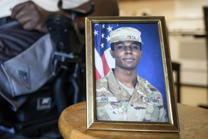 A portrait of American soldier Travis King is displayed as his grandfather, Carl Gates, talks about his grandson on July 19, 2023, in Kenosha, Wis. North Korea asserted Wednesday, Aug. 15, 2023, that Gates, a U.S. soldier who bolted into the North across the heavily armed Korean border last month, did so after being disillusioned with the inequality of American society and racial discrimination in its Army. (AP Photo/Morry Gash, File)