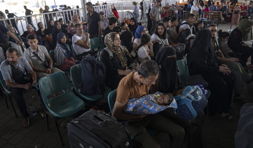 Palestinians wait to cross into Egypt at Rafah, Gaza Strip, on Wednesday, Nov. 1, 2023. (AP Photo/Fatima Shbair)