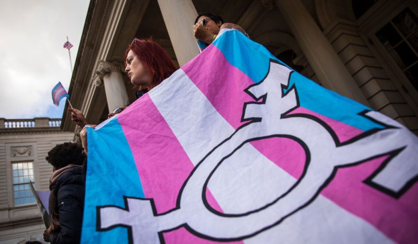 NEW YORK, NY - OCTOBER 24: L.G.B.T. activists and their supporters rally in support of transgender people on the steps of New York City Hall, October 24, 2018 in New York City. The group gathered to speak out against the Trump administration's stance toward transgender people. Last week, The New York Times reported on an unreleased administration memo that proposes a strict biological definition of gender based on a person's genitalia at birth. (Photo by Drew Angerer/Getty Images)