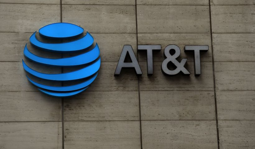 DALLAS, TEXAS - MARCH 13: The logo of AT&T outside of AT&T corporate headquarters on March 13, 2020 in Dallas, Texas. AT&T is allowing employees to work remotely from home if they have the ability to do so, as a safety measure due to COVID-19. (Photo by Ronald Martinez/Getty Images)