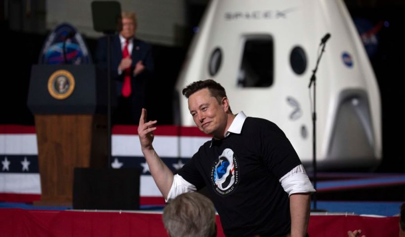 CAPE CANAVERAL, FLORIDA - MAY 30: U.S. President Donald Trump acknowledges SpaceX founder Elon Musk (R) after the successful launch of the SpaceX Falcon 9 rocket with the manned Crew Dragon spacecraft at the Kennedy Space Center on May 30, 2020 in Cape Canaveral, Florida. Earlier in the day NASA astronauts Bob Behnken and Doug Hurley lifted off on the inaugural flight and will be the first people since the end of the Space Shuttle program in 2011 to be launched into space from the United States. (Photo by Saul Martinez/Getty Images)