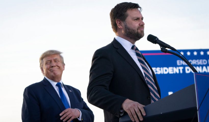 DELAWARE, OH - APRIL 23: (L-R) Former President Donald Trump listens as J.D. Vance, a Republican candidate for U.S. Senate in Ohio, speaks during a rally hosted by the former president at the Delaware County Fairgrounds on April 23, 2022 in Delaware, Ohio. Last week, Trump announced his endorsement of J.D. Vance in the Ohio Republican Senate primary. (Photo by Drew Angerer/Getty Images)