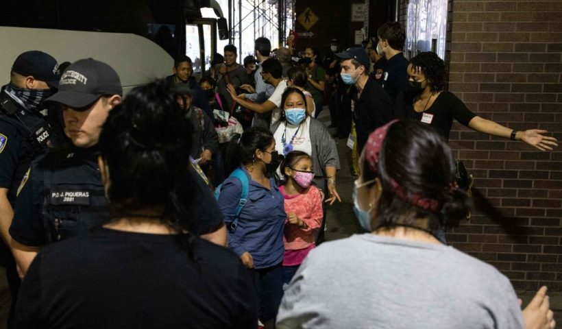 A bus carrying migrants from Texas arrives at Port Authority Bus Terminal on August 10, 2022 in New York. - Texas has sent thousands of migrants from the border state into Washington, DC, New York City, and other areas. (Photo by Yuki IWAMURA / AFP) (Photo by YUKI IWAMURA/AFP via Getty Images)