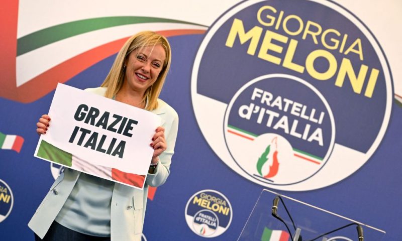 Leader of Italian far-right party "Fratelli d'Italia" (Brothers of Italy), Giorgia Meloni holds a placard reading "Thank You Italy" after she delivered an address at her party's campaign headquarters overnight on September 26, 2022 in Rome, after the country voted in a legislative election. - Far-right leader Giorgia Meloni won big in Italian elections on September 25, the first projections suggested, putting her eurosceptic populists on course to take power at the heart of Europe. (Photo by Andreas SOLARO / AFP) (Photo by ANDREAS SOLARO/AFP via Getty Images)