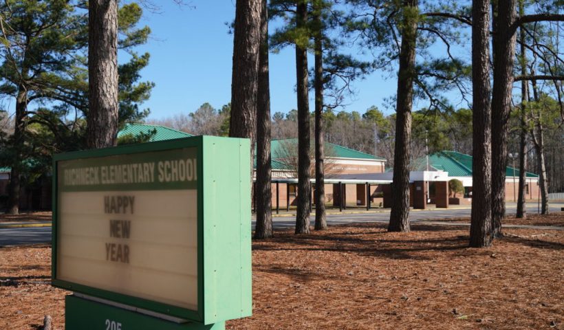 NEWPORT NEWS, VA - JANUARY 07: A school sign wishing students a "Happy New Year" is seen outside Richneck Elementary School on January 7, 2023 in Newport News, Virginia. A 6-year-old student was taken into custody after reportedly shooting a teacher during an altercation in a classroom at Richneck Elementary School on Friday. The teacher, a woman in her 30s, suffered “life-threatening” injuries and remains in critical condition, according to police reports. (Photo by Jay Paul/Getty Images)