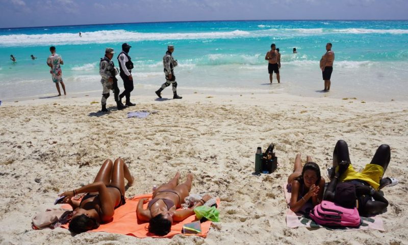 Members of the Mexican Navy and National Guard patrol the tourist beach area of Cancun, Quintana Roo state, Mexico on March 18, 2023. - US students on spring break, known as "spring-breakers", are flocking to the Mexican Caribbean despite warnings from Washington to travel to the southern neighbour due to a wave of attacks on US citizens. (Photo by ELIZABETH RUIZ / AFP) (Photo by ELIZABETH RUIZ/AFP via Getty Images)