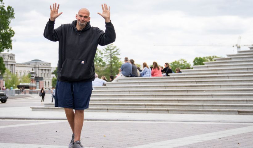 WASHINGTON, DC - APRIL 17: U.S. Sen. John Fetterman (D-PA) waves to reporters as he arrives at the U.S. Capitol on April 17, 2023 in Washington, DC. Fetterman is returning to the Senate following six weeks of treatment for clinical depression. (Photo by Drew Angerer/Getty Images)