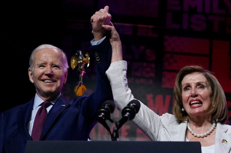 US President Joe Biden and honoree House Speaker Emerita Nancy Pelosi stand onstage during Emily's List annual We Are Emily National Gala at The Anthem in Washington, DC, May 16, 2023. This year House Speaker Emerita Nancy Pelosi is being honored along with a celebration of Democratic pro-choice women bringing change to their communities and the world in elected office, and future elected women who will secure and restore women's rights. (Photo by OLIVIER DOULIERY / AFP) (Photo by OLIVIER DOULIERY/AFP via Getty Images)