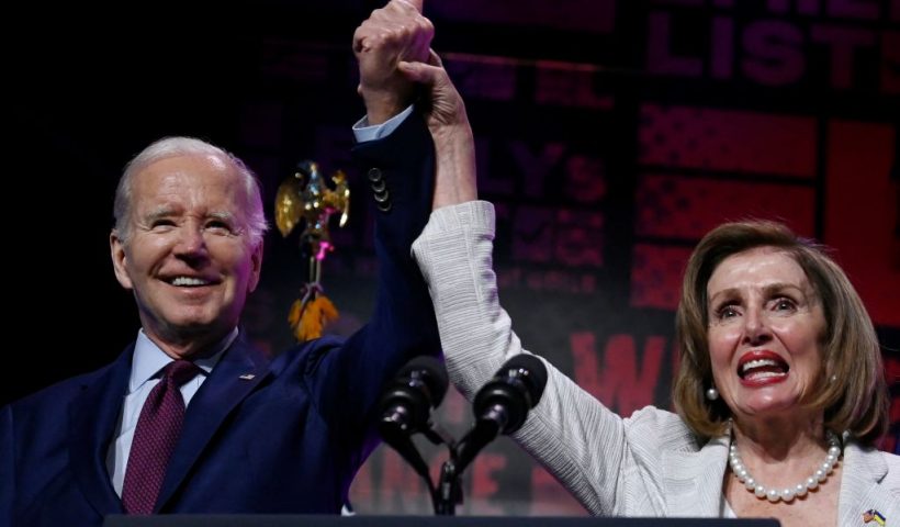 US President Joe Biden and honoree House Speaker Emerita Nancy Pelosi stand onstage during Emily's List annual We Are Emily National Gala at The Anthem in Washington, DC, May 16, 2023. This year House Speaker Emerita Nancy Pelosi is being honored along with a celebration of Democratic pro-choice women bringing change to their communities and the world in elected office, and future elected women who will secure and restore women's rights. (Photo by OLIVIER DOULIERY / AFP) (Photo by OLIVIER DOULIERY/AFP via Getty Images)