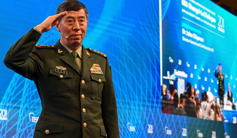 China's Minister of National Defence Li Shangfu salutes the audience before delivering a speech during the 20th Shangri-La Dialogue summit in Singapore on June 4, 2023. (Photo by Roslan RAHMAN / AFP) (Photo by ROSLAN RAHMAN/AFP via Getty Images)