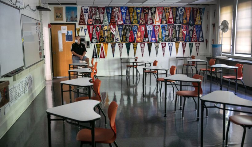 STAMFORD, CONNECTICUT - AUGUST 26: Stamford High School principal Raymond Manka sits in a socially-distanced classroom ahead of the return of students on August 26, 2020 in Stamford, Connecticut. Stamford Public Schools are scheduled to begin the fall semester on September 8 with a hybrid model due to the coronavirus pandemic. Students will attend class every other day and take part in distance learning from home. (Photo by John Moore/Getty Images)