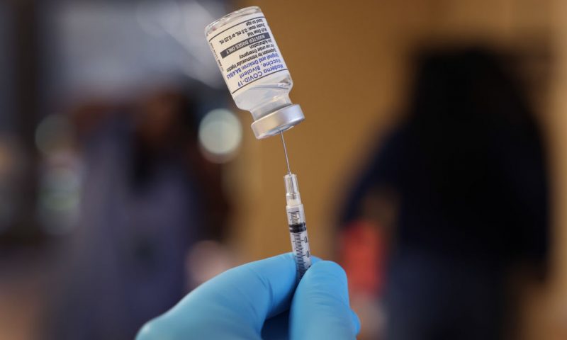 CHICAGO, ILLINOIS - SEPTEMBER 09: A pharmacist prepares to administer COVID-19 vaccine booster shots during an event hosted by the Chicago Department of Public Health at the Southwest Senior Center on September 09, 2022 in Chicago, Illinois. The recently authorized booster vaccine protects against the original SARS-CoV-2 virus and the more recent omicron variants, BA.4 and BA.5. (Photo by Scott Olson/Getty Images)