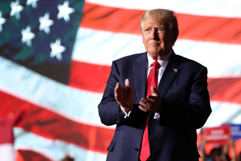 MINDEN, NEVADA - OCTOBER 08: Former U.S. President Donald Trump greets supporters during a campaign rally at Minden-Tahoe Airport on October 08, 2022 in Minden, Nevada. Former U.S. President Donald Trump held a campaign style rally for Nevada GOP candidates ahead of the state's midterm election on November 8th.  (Photo by Justin Sullivan/Getty Images)