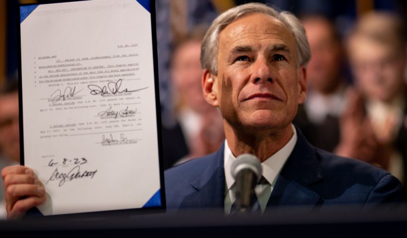 AUSTIN, TEXAS - JUNE 08: Texas Gov. Greg Abbott displays a bill he signed at a news conference at the state Capitol on June 08, 2023 in Austin, Texas. Abbott and Texas Department of Public Safety Director Steve McCraw joined bill authors, sponsors, legislators and law enforcement members in the signing of bills aimed at enhancing southern border security. (Photo by Brandon Bell/Getty Images)