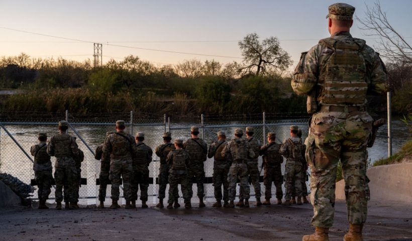 EAGLE PASS, TEXAS - JANUARY 12: National Guard soldiers stand guard on the banks of the Rio Grande river at Shelby Park on January 12, 2024 in Eagle Pass, Texas. The Texas National Guard continues its blockade and surveillance of Shelby Park in an effort to deter illegal immigration. The Department of Justice has accused the Texas National Guard of blocking Border Patrol agents from carrying out their duties along the river. (Photo by Brandon Bell/Getty Images)