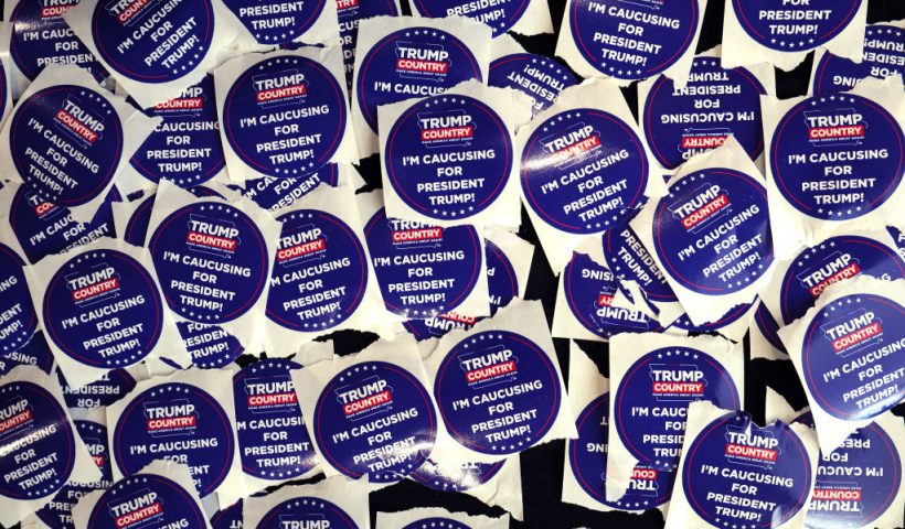 INDIANOLA, IOWA - JANUARY 14: Campaign stickers sit on a table during a rally with former President Donald Trump at Simpson College on January 14, 2024 in Indianola, Iowa. The event was Trump's final scheduled event before tomorrow's Iowa Caucus. (Photo by Scott Olson/Getty Images)