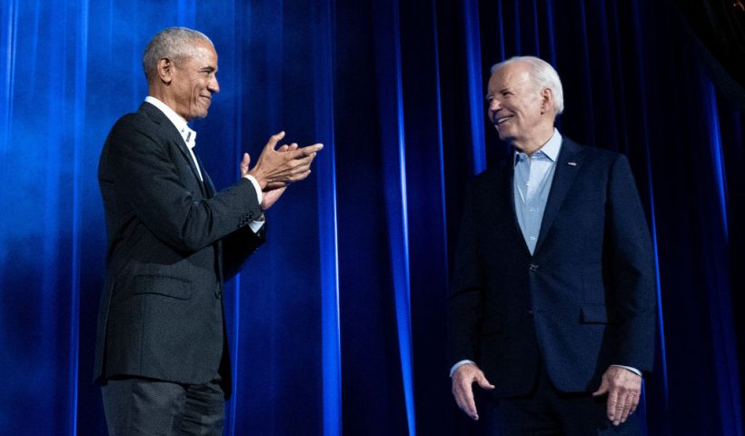 Former US President Barack Obama (L) claps for US President Joe Biden during a campaign fundraising event at Radio City Music Hall in New York City on March 28, 2024. (Photo by Brendan Smialowski / AFP) (Photo by BRENDAN SMIALOWSKI/AFP via Getty Images)