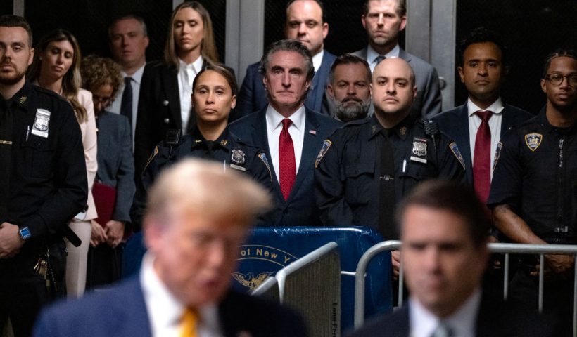 NEW YORK, NEW YORK - MAY 14: Supporters of former U.S. President Trump, including North Dakota Governor Doug Burgum (C), U.S. Rep. Cory Mills (R-FL) (C-R) and businessman Vivek Ramaswamy (2nd-R) listen as Trump speaks to the media at the end of the day's proceedings in his trial for allegedly covering up hush money payments linked to an extramarital affair with Stormy Daniels, at Manhattan Criminal Court on May 14, 2024 in New York City. Former U.S. President Donald Trump faces 34 felony counts of falsifying business records in the first of his criminal cases to go to trial. (Photo by Craig Ruttle - Pool/Getty Images)