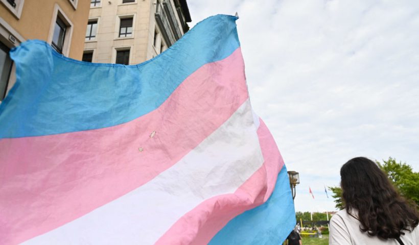 A transgender flag flies during a demonstration for trans rights in Lyon, France on 25 May 2024. (Photo by Matthieu Delaty / Hans Lucas / Hans Lucas via AFP) (Photo by MATTHIEU DELATY/Hans Lucas/AFP via Getty Images)