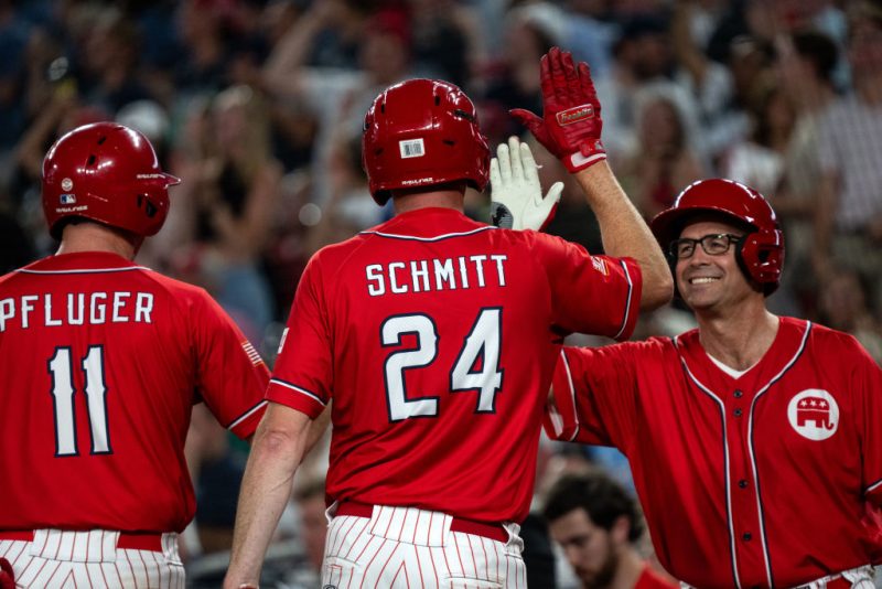 WASHINGTON, DC - JUNE 12: Rep. August Pfluger (R-TX) and Sen. Eric Schmitt (R-MO) celebrate with Rep. Jake Ellzey (R-TX) during the Congressional Baseball Game for Charity at National's Park on June 12, 2024 in Washington, DC. The annual bipartisan game was first played in 1909. (Photo by Kent Nishimura/Getty Images)