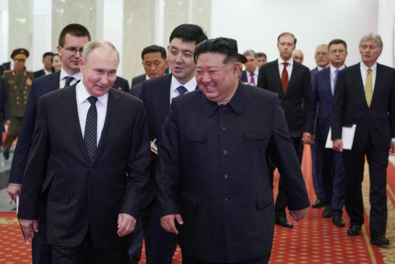 TOPSHOT - In this pool photograph distributed by the Russian state agency Sputnik, Russian President Vladimir Putin (L) and North Korea's leader Kim Jong Un (C) attend a Gala concert in Pyongyang, on June 19, 2024. (Photo by Gavriil GRIGOROV / POOL / AFP) / -- Editor's note : this image is distributed by the Russian state owned agency Sputnik - (Photo by GAVRIIL GRIGOROV/POOL/AFP via Getty Images)