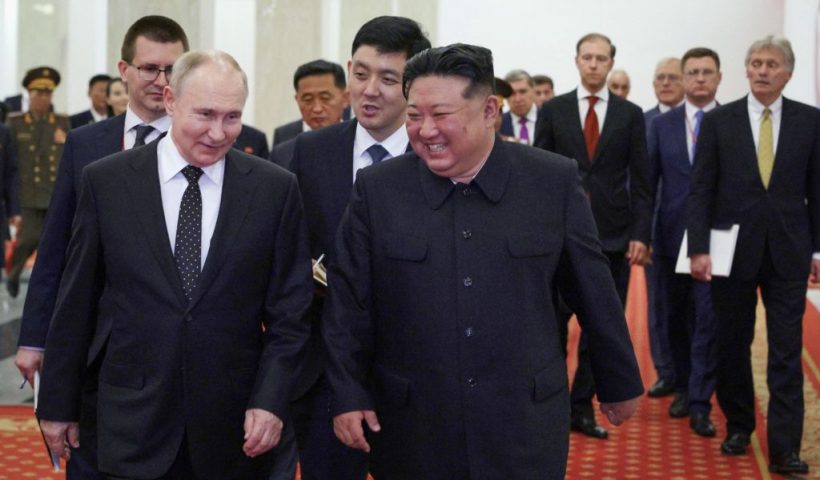 TOPSHOT - In this pool photograph distributed by the Russian state agency Sputnik, Russian President Vladimir Putin (L) and North Korea's leader Kim Jong Un (C) attend a Gala concert in Pyongyang, on June 19, 2024. (Photo by Gavriil GRIGOROV / POOL / AFP) / -- Editor's note : this image is distributed by the Russian state owned agency Sputnik - (Photo by GAVRIIL GRIGOROV/POOL/AFP via Getty Images)