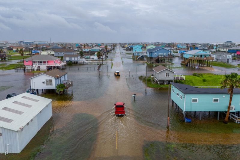 SURFSIDE BEACH, TEXAS - JUNE 19: In this aerial image, vehicles drive through flooded neighborhoods on June 19, 2024 in Surfside Beach, Texas. Storm Alberto, the first named tropical storm of the hurricane season, was located approximately 305 miles south-southeast of Brownsville, Texas and formed earlier today in the Southwestern Gulf of Mexico. The storm has produced heavy winds and rainfall, creating flooding within various communities along Texas coastlines. (Photo by Brandon Bell/Getty Images)