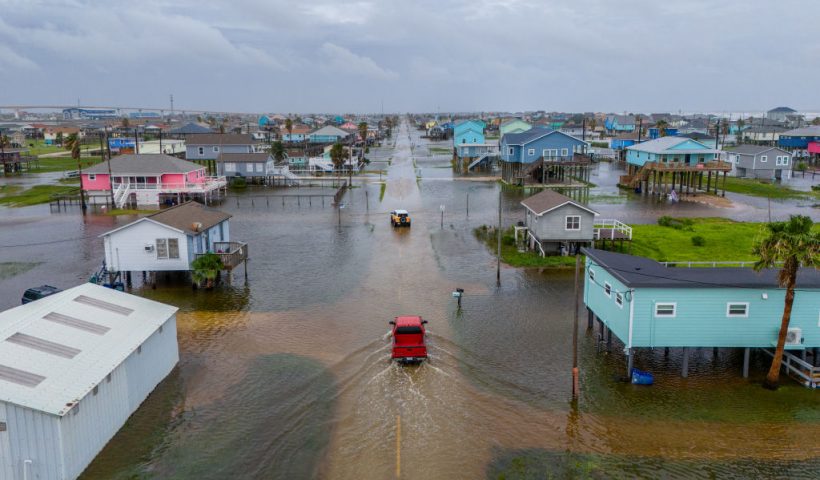 SURFSIDE BEACH, TEXAS - JUNE 19: In this aerial image, vehicles drive through flooded neighborhoods on June 19, 2024 in Surfside Beach, Texas. Storm Alberto, the first named tropical storm of the hurricane season, was located approximately 305 miles south-southeast of Brownsville, Texas and formed earlier today in the Southwestern Gulf of Mexico. The storm has produced heavy winds and rainfall, creating flooding within various communities along Texas coastlines. (Photo by Brandon Bell/Getty Images)