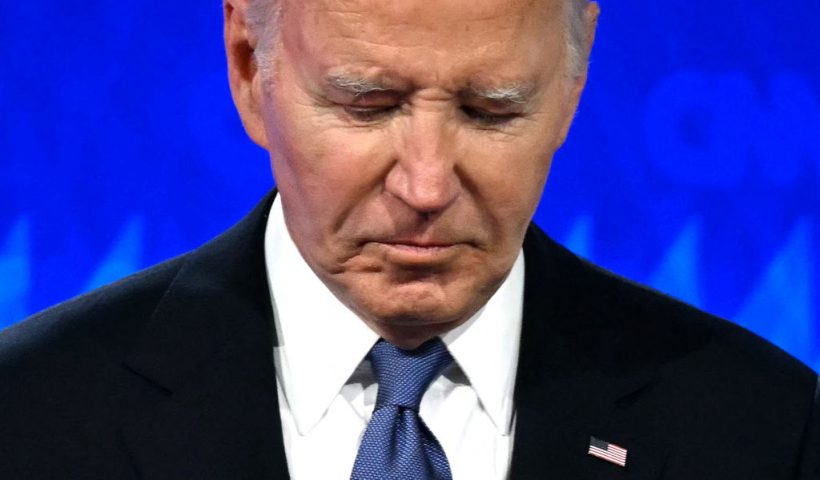 TOPSHOT - US President Joe Biden looks down as he participates in the first presidential debate of the 2024 elections with former US President and Republican presidential candidate Donald Trump at CNN's studios in Atlanta, Georgia, on June 27, 2024. (Photo by Andrew CABALLERO-REYNOLDS / AFP) (Photo by ANDREW CABALLERO-REYNOLDS/AFP via Getty Images)