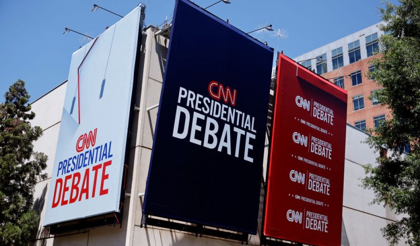 ATLANTA, GEORGIA - JUNE 25: Signs advertising the presidential debate hosted by CNN are seen outside of their studios on June 25, 2024 in Atlanta, Georgia. U.S. President Joe Biden and Republican presidential candidate former President Donald Trump will face off in the first presidential debate of the 2024 presidential cycle this Thursday. (Photo by Kevin Dietsch/Getty Images)