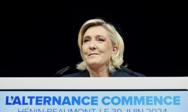 Former president of the French far-right Rassemblement National (RN) parliamentary group Marine Le Pen gives a speech during the results evening of the first round of the parliamentary elections in Henin-Beaumont, northern France, on June 30, 2024. A divided France is voting in high-stakes parliamentary elections that could see the anti-immigrant and eurosceptic party of Marine Le Pen sweep to power in a historic first. The candidates formally ended their frantic campaigns at midnight June 28, with political activity banned until the first round of voting. (Photo by FRANCOIS LO PRESTI / AFP) (Photo by FRANCOIS LO PRESTI/AFP via Getty Images)