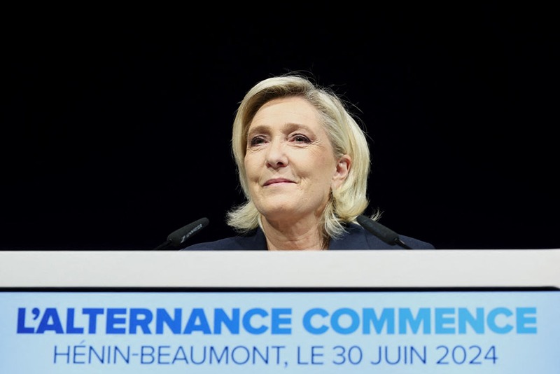 Former president of the French far-right Rassemblement National (RN) parliamentary group Marine Le Pen gives a speech during the results evening of the first round of the parliamentary elections in Henin-Beaumont, northern France, on June 30, 2024. A divided France is voting in high-stakes parliamentary elections that could see the anti-immigrant and eurosceptic party of Marine Le Pen sweep to power in a historic first. The candidates formally ended their frantic campaigns at midnight June 28, with political activity banned until the first round of voting. (Photo by FRANCOIS LO PRESTI / AFP) (Photo by FRANCOIS LO PRESTI/AFP via Getty Images)