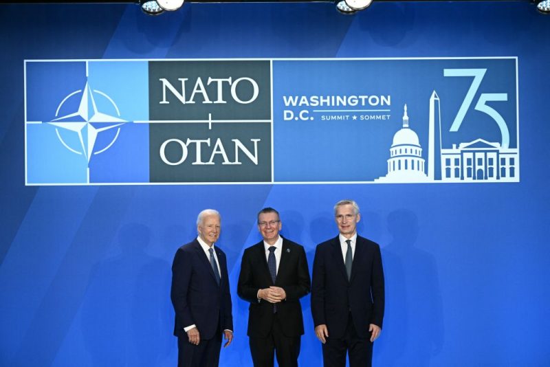 Latvia's President Edgars Rinkevics (C) poses with US President Joe Biden (L) and NATO Secretary General Jens Stoltenberg during the NATO 75th anniversary summit at the Walter E. Washington Convention Center in Washington, DC, on July 10, 2024. (Photo by Brendan SMIALOWSKI / AFP) (Photo by BRENDAN SMIALOWSKI/AFP via Getty Images)