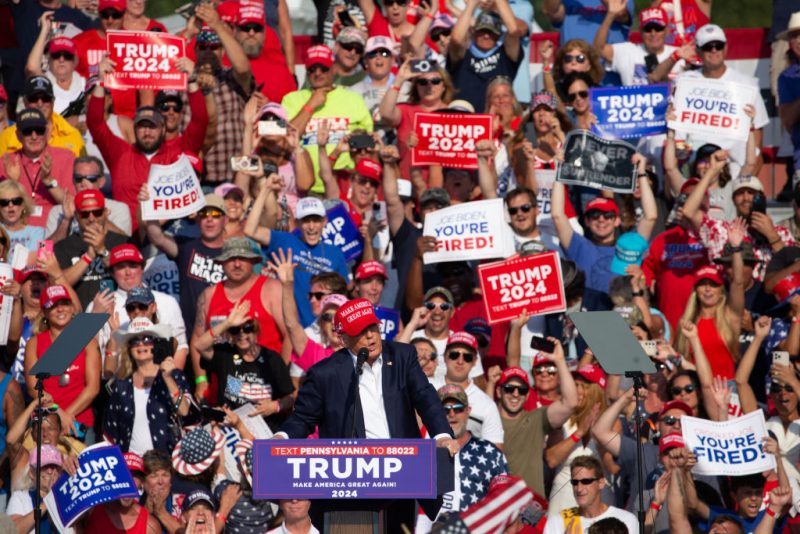 TOPSHOT - Former US President and Republican presidential candidate Donald Trump speaks during a campaign event at Butler Farm Show Inc. in Butler, Pennsylvania, July 13, 2024. Donald Trump was hit in the ear in an apparent assassination attempt by a gunman at a campaign rally on Saturday, in a chaotic and shocking incident that will fuel fears of instability ahead of the 2024 US presidential election. (Photo by Rebecca DROKE / AFP) (Photo by REBECCA DROKE/AFP via Getty Images)