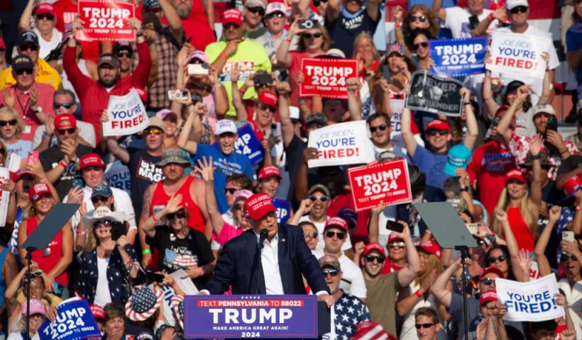 TOPSHOT - Former US President and Republican presidential candidate Donald Trump speaks during a campaign event at Butler Farm Show Inc. in Butler, Pennsylvania, July 13, 2024. Donald Trump was hit in the ear in an apparent assassination attempt by a gunman at a campaign rally on Saturday, in a chaotic and shocking incident that will fuel fears of instability ahead of the 2024 US presidential election. (Photo by Rebecca DROKE / AFP) (Photo by REBECCA DROKE/AFP via Getty Images)