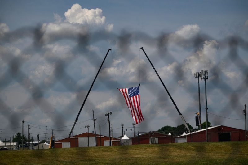 BUTLER, PENNSYLVANIA - JULY 14: The American flag, that served as the backdrop for a campaign rally by former President and current Republican candidate Donald J. Trump, blows in the wind at Butler Fairgrounds in the aftermath of the attempted assassination of the former president on July 14, 2024 in Butler, Pennsylvania. Trump was escorted away by the Secret Service with an injury to his ear. According to reports, the FBI has identified the gunman, killed at the scene, as 20-year-old Thomas Matthew Crooks. One attendee at the rally on July 13 was killed and two others severely injured. (Photo by Jeff Swensen/Getty Images)