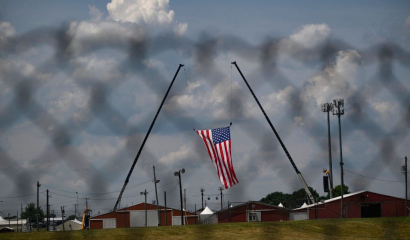 BUTLER, PENNSYLVANIA - JULY 14: The American flag, that served as the backdrop for a campaign rally by former President and current Republican candidate Donald J. Trump, blows in the wind at Butler Fairgrounds in the aftermath of the attempted assassination of the former president on July 14, 2024 in Butler, Pennsylvania. Trump was escorted away by the Secret Service with an injury to his ear. According to reports, the FBI has identified the gunman, killed at the scene, as 20-year-old Thomas Matthew Crooks. One attendee at the rally on July 13 was killed and two others severely injured. (Photo by Jeff Swensen/Getty Images)