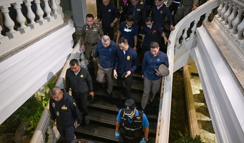 Policemen inspect after an incident, in which six bodies were found at a hotel in Bangkok on July 16, 2024. Six people believed to be Vietnamese and Vietnamese-Americans were found dead in a hotel room in central Bangkok on July 16, a senior police officer said. (Photo by Lillian SUWANRUMPHA / AFP) (Photo by LILLIAN SUWANRUMPHA/AFP via Getty Images)