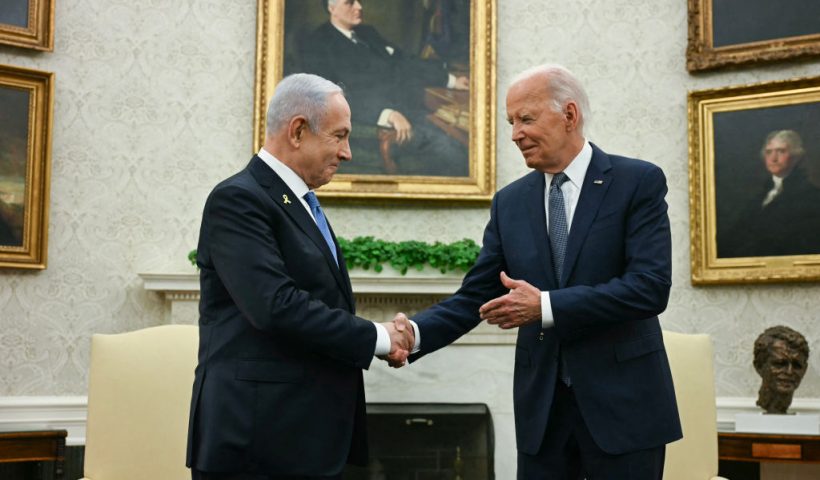 TOPSHOT - US President Joe Biden (R) shakes hands with Israeli Prime Minister Benjamin Netanyahu during a meeting in the Oval Office of the White House in Washington, DC, on July 25, 2024. (Photo by Jim WATSON / AFP) (Photo by JIM WATSON/AFP via Getty Images)