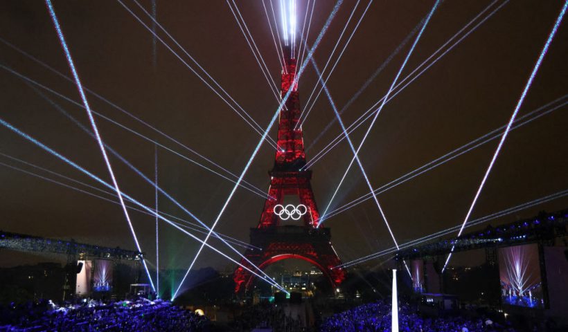 Lights illuminate the Eiffel Tower during the opening ceremony of the Paris 2024 Olympic Games in Paris on July 26, 2024. (Photo by Ludovic MARIN / POOL / AFP) (Photo by LUDOVIC MARIN/POOL/AFP via Getty Images)