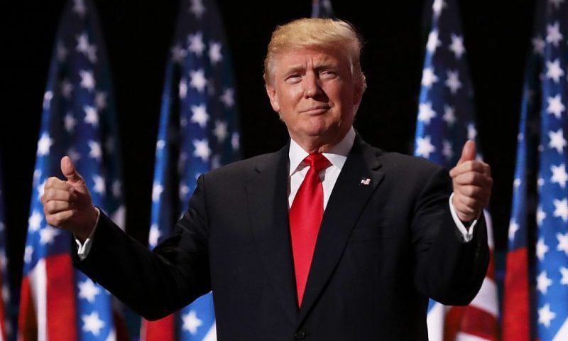 CLEVELAND, OH - JULY 21: Republican presidential candidate Donald Trump gives two thumbs up to the crowd during the evening session on the fourth day of the Republican National Convention on July 21, 2016 at the Quicken Loans Arena in Cleveland, Ohio. Republican presidential candidate Donald Trump received the number of votes needed to secure the party's nomination. An estimated 50,000 people are expected in Cleveland, including hundreds of protesters and members of the media. The four-day Republican National Convention kicked off on July 18. (Photo by Chip Somodevilla/Getty Images)