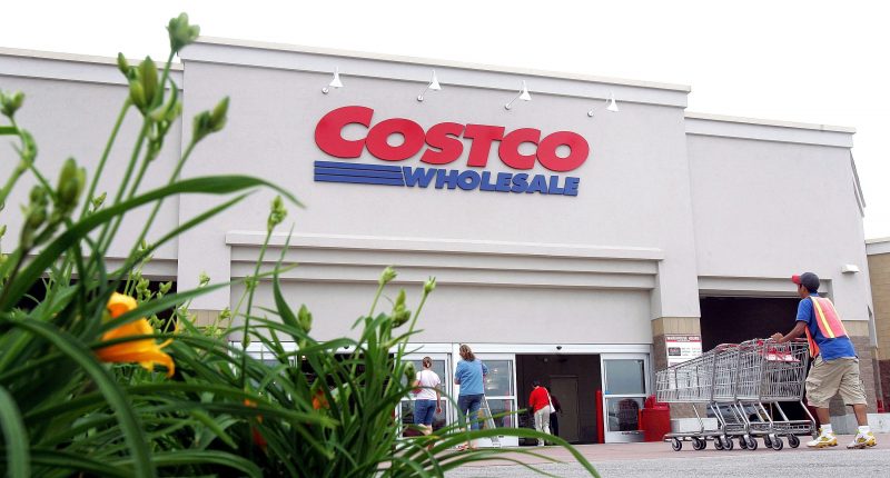 MOUNT PROSPECT, IL - MAY 31:  A worker pushes carts outside a Costco Wholesale store May 31, 2006 in Mount Prospect, Illinois. Third-quarter earnings reported today were up at Costco, the nation's largest warehouse club operator, although current oil prices affected margins at their associated gas stations.  (Photo by Tim Boyle/Getty Images)