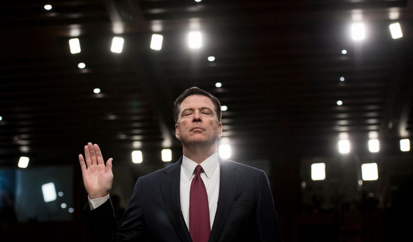 TOPSHOT - Ousted FBI director James Comey is sworn in during a hearing before the Senate Select Committee on Intelligence on Capitol Hill June 8, 2017 in Washington, DC. Fired FBI director James Comey took the stand Thursday in a crucial Senate hearing, repeating explosive allegations that President Donald Trump badgered him over the highly sensitive investigation Russia's meddling in the 2016 election. (Photo by Brendan Smialowski / AFP) (Photo by BRENDAN SMIALOWSKI/AFP via Getty Images)