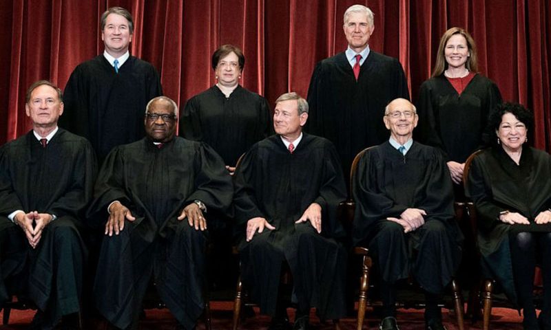 Erin Schaff/Pool via AP Members of the Supreme Court pose for a group photo at the Supreme Court in Washington, D.C., April 23, 2021. Seated from left, Associate Justice Samuel Alito, Associate Justice Clarence Thomas, Chief Justice John Roberts, Associate Justice Stephen Breyer and Associate Justice Sonia Sotomayor. Standing from left, Associate Justice Brett Kavanaugh, Associate Justice Elena Kagan, Associate Justice Neil Gorsuch and Associate Justice Amy Coney Barrett.