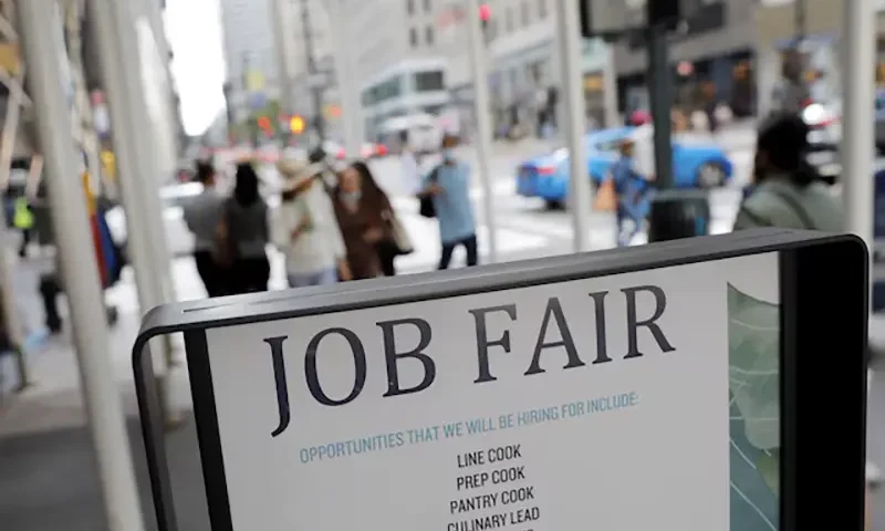 Signage for a job fair is seen on 5th Avenue after the release of the jobs report in Manhattan, New York City, U.S., September 3, 2021. REUTERS/Andrew Kelly/File Photo