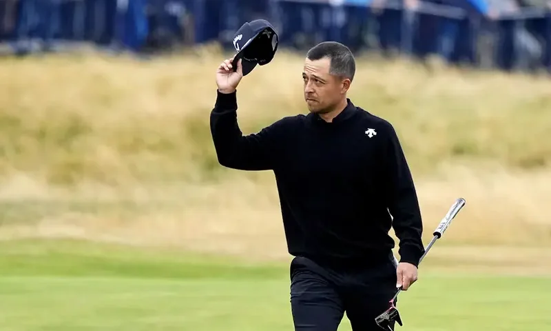 Xander Schauffele waves to the gallery as he walks to the 18th green during the final round of the Open Championship golf tournament at Royal Troon. Mandatory Credit: Jack Gruber-USA TODAY Sports