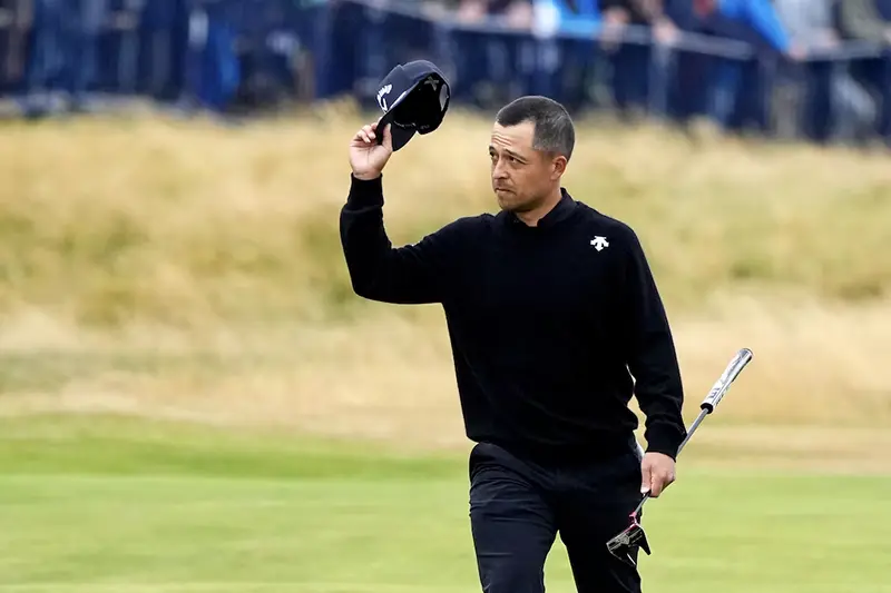 Xander Schauffele waves to the gallery as he walks to the 18th green during the final round of the Open Championship golf tournament at Royal Troon. Mandatory Credit: Jack Gruber-USA TODAY Sports