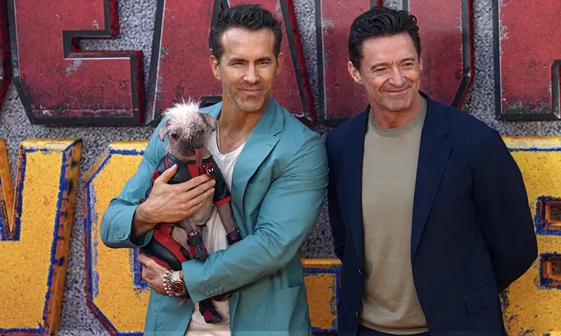 Hugh Jackman, Ryan Reynolds and Peggy the dog attend a 'Deadpool & Wolverine' UK sneak peek event in London, Britain, July 11, 2024. REUTERS/Maja Smiejkowska