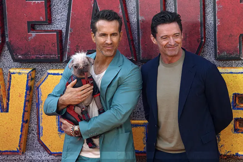 Hugh Jackman, Ryan Reynolds and Peggy the dog attend a 'Deadpool & Wolverine' UK sneak peek event in London, Britain, July 11, 2024. REUTERS/Maja Smiejkowska